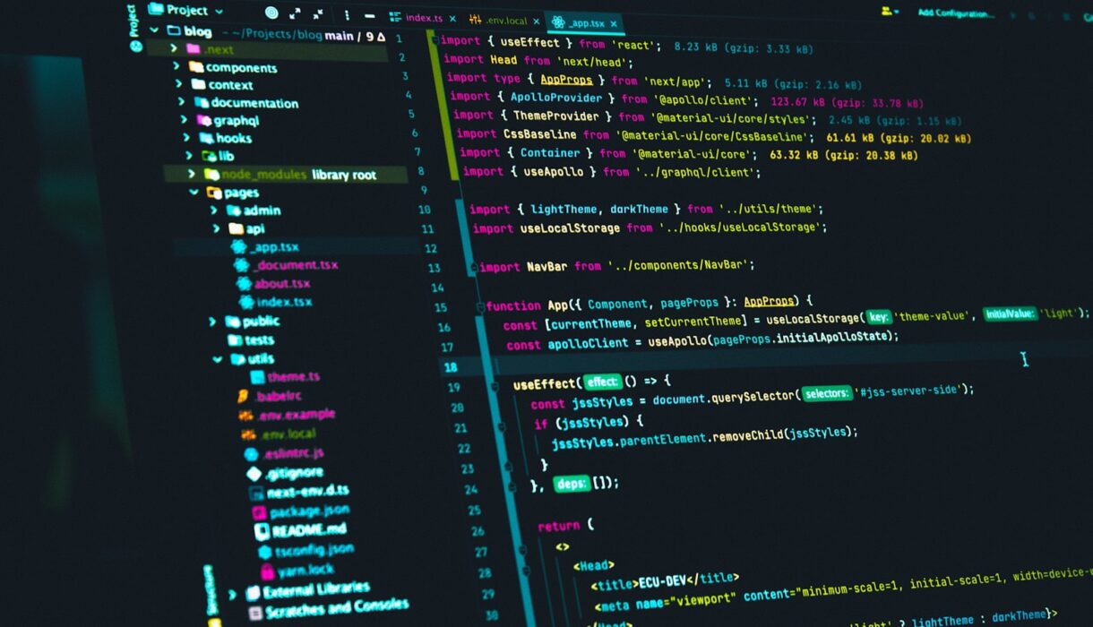 A code editor on a dark screen showing React source code